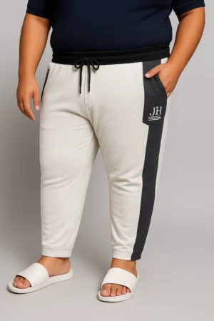 Men’s white and black slim fit colorblock joggers with zipper pockets and drawstring waist